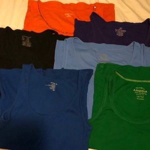 Six tank tops lightly worn.